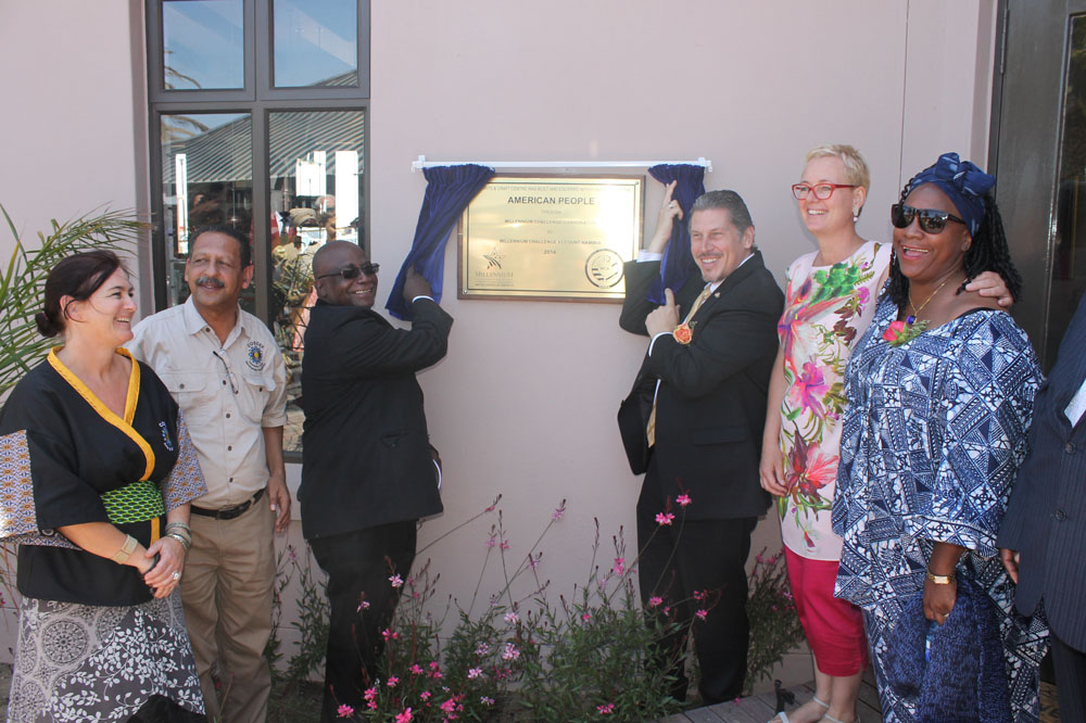 Reverend Ludwig Hausiku, Special Advisor to the Minister of Youth and U.S. Chargé d’Affaires, John Kowalski unveil the plaque to officially open the Swakopmund Arts and Craft Centre.
